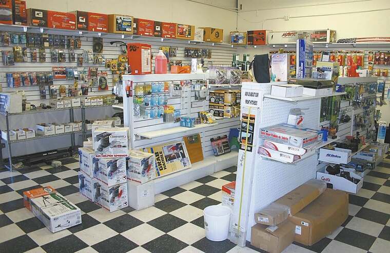 The RV parts showroom, with stocked shelves and a checkerboard floor